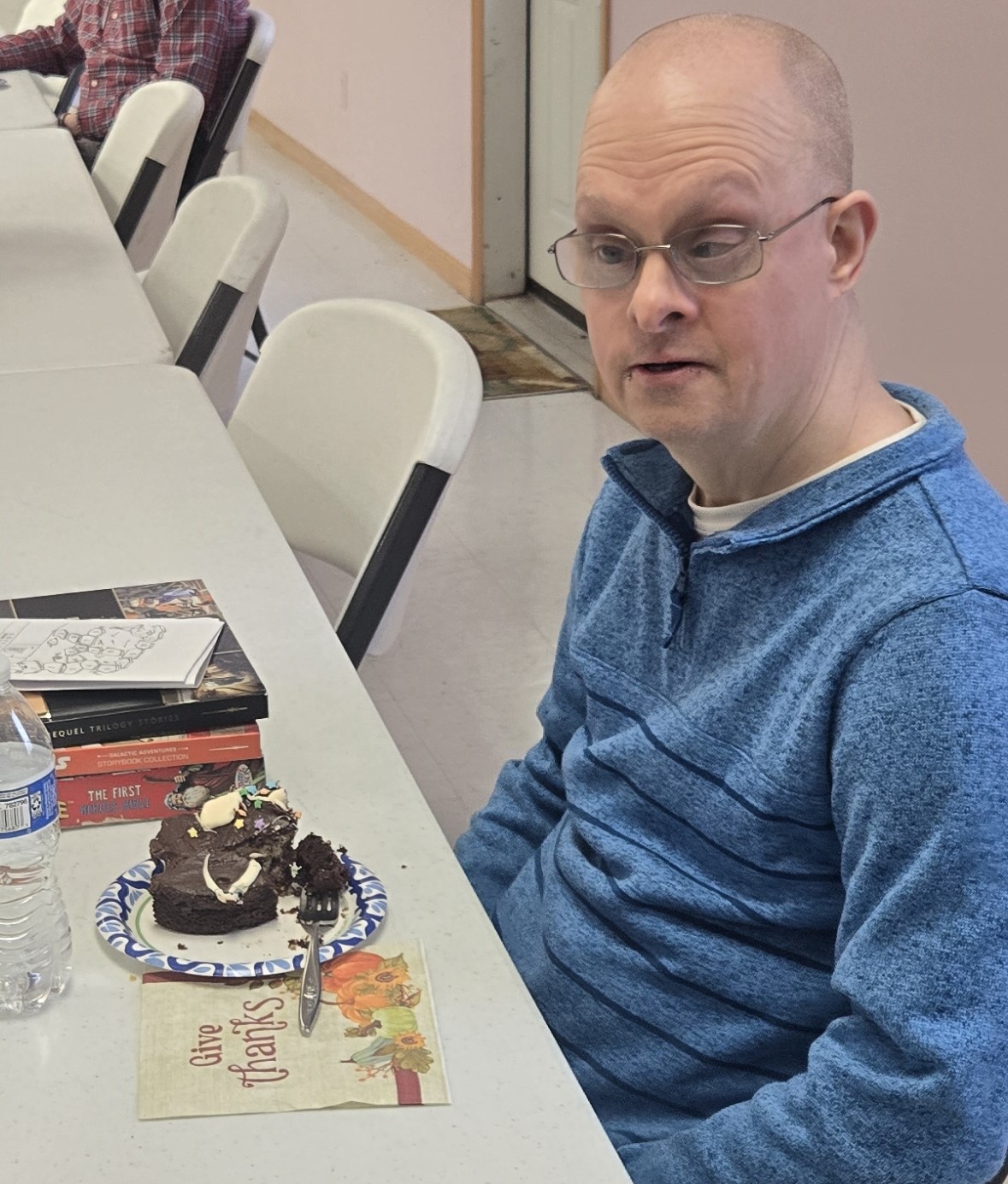 Chris VanBeek fellowship photo with a cake.